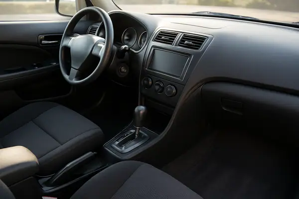 Clean car interior with vacuumed seats and a freshly wiped dashboard.